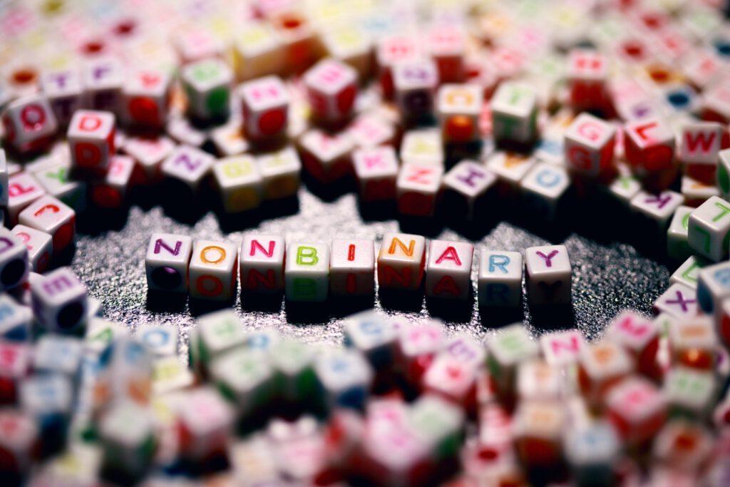Beads spelling out "non-binary"