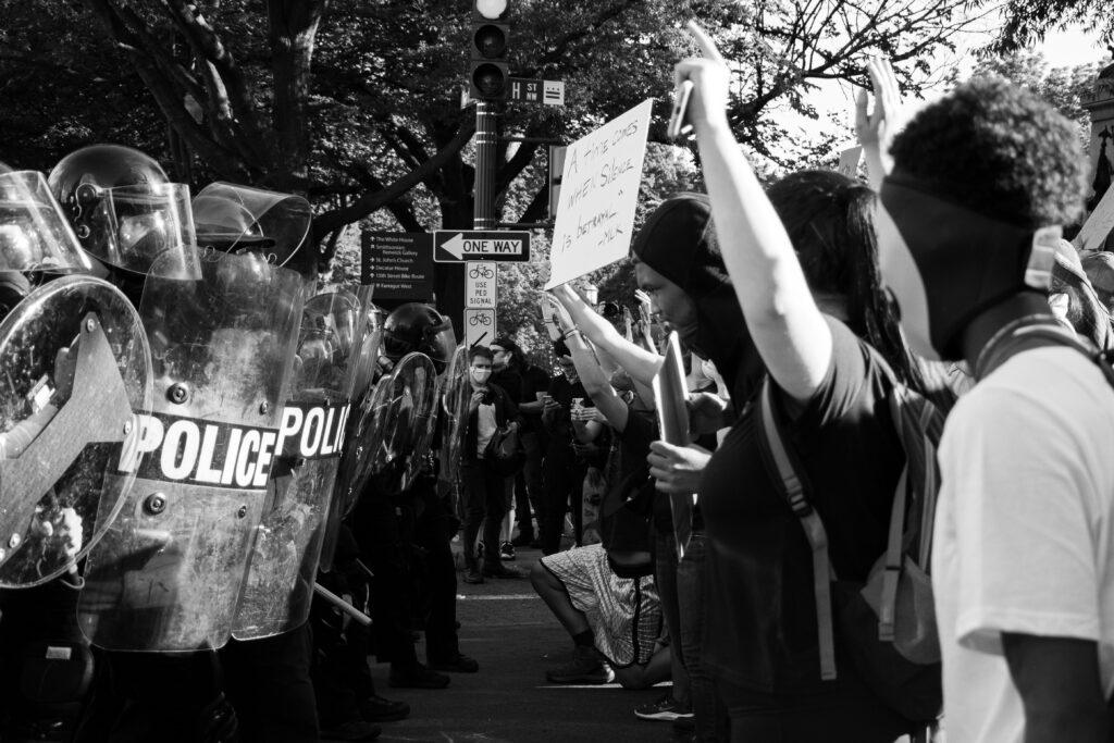 Protests and police officers confronting each other